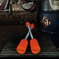 DRIV3D Stuntpegs – ORANGE – Kompakte Axle Sliders (60 mm)